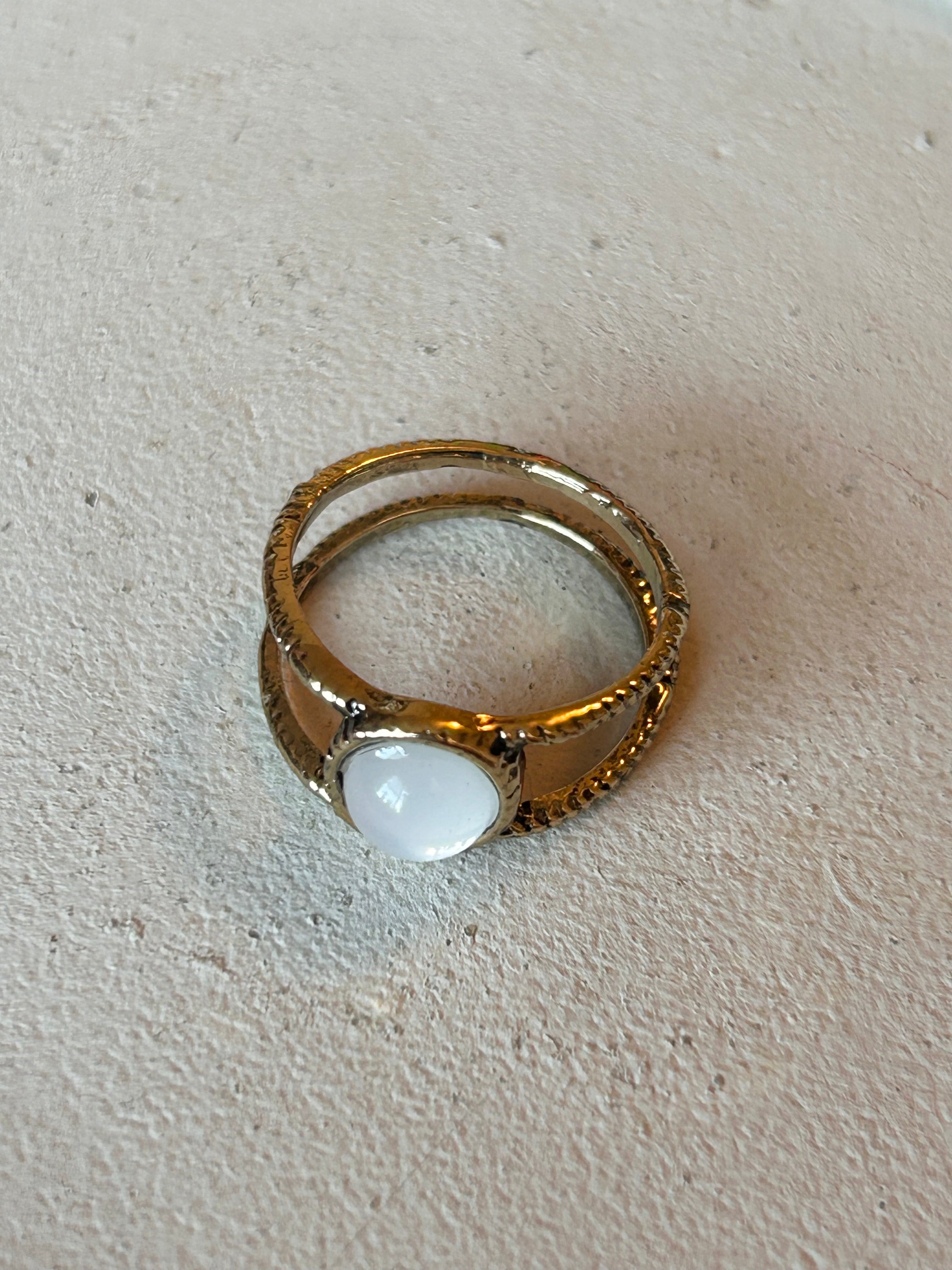 Clear round stone ring